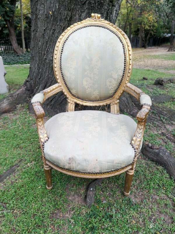 A Pair Of French Style Giltwood Ornate Arm Chairs On Fluted Legs 