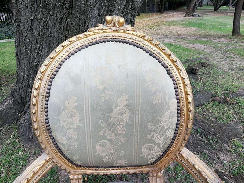 A Pair Of French Style Giltwood Ornate Arm Chairs On Fluted Legs 