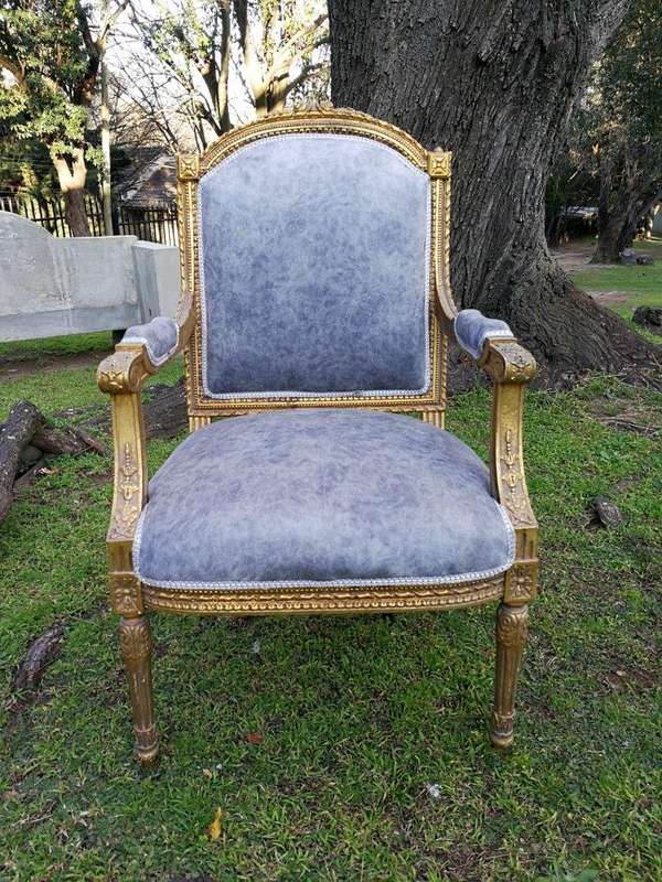 A Pair of French Style Giltwood Ornate Arm Chairs on Fluted legs 