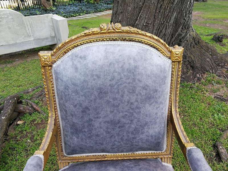 A Pair of French Style Giltwood Ornate Arm Chairs on Fluted legs 