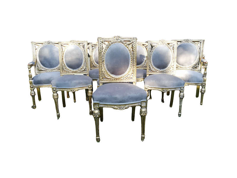 A Set of Eight French Style Ornately Carved and Gilded Dining Chairs (6 chairs and 2 Carvers)