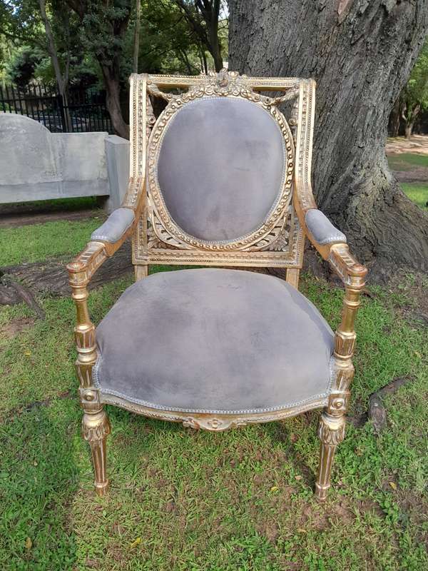 A Set of Eight French Style Ornately Carved and Gilded Dining Chairs (6 chairs and 2 Carvers)