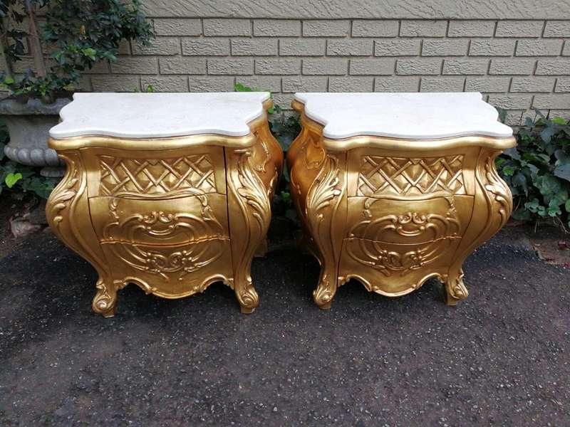 A Pair of French Style Ornately Carved Bombe Giltwood Pedestals/Side Tables with Marble Tops