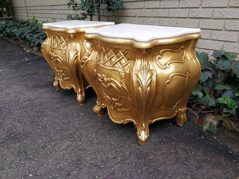 A Pair of French Style Ornately Carved Bombe Giltwood Pedestals/Side Tables with Marble Tops