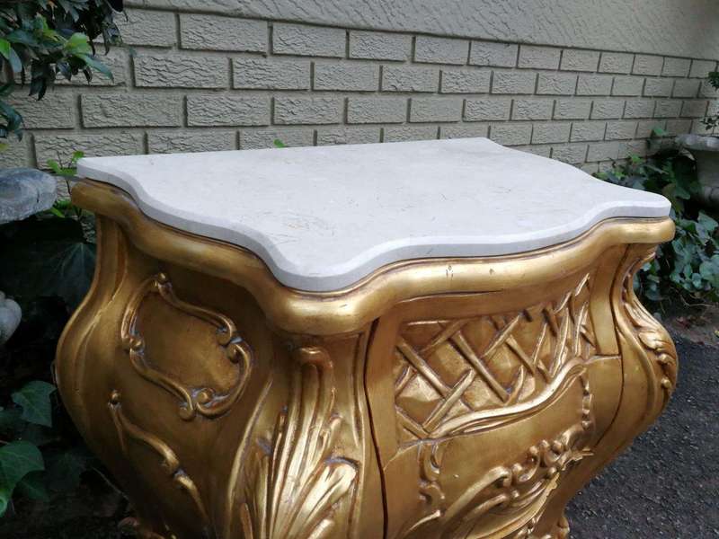 A Pair of French Style Ornately Carved Bombe Giltwood Pedestals/Side Tables with Marble Tops