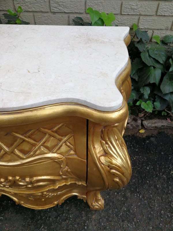 A Pair of French Style Ornately Carved Bombe Giltwood Pedestals/Side Tables with Marble Tops