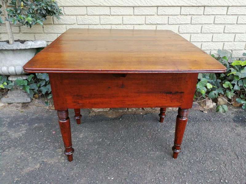 An Antique 19h Century Burmese Teak Drop-Side Table With Drawer