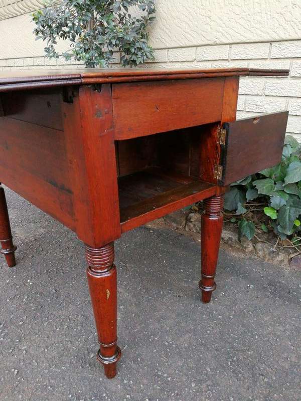 An Antique 19h Century Burmese Teak Drop-Side Table With Drawer
