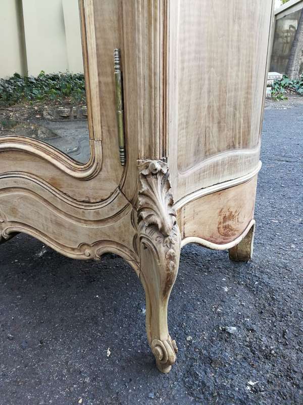 An Early 20th Century French-Style Carved Mahogany And Bevelled Mirrored Armoire in a Contemporar...