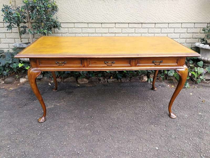 A 20th Century Victorian-Style Blonde Mahogany Desk With Leather And Gilt Tooling And Three Drawe...