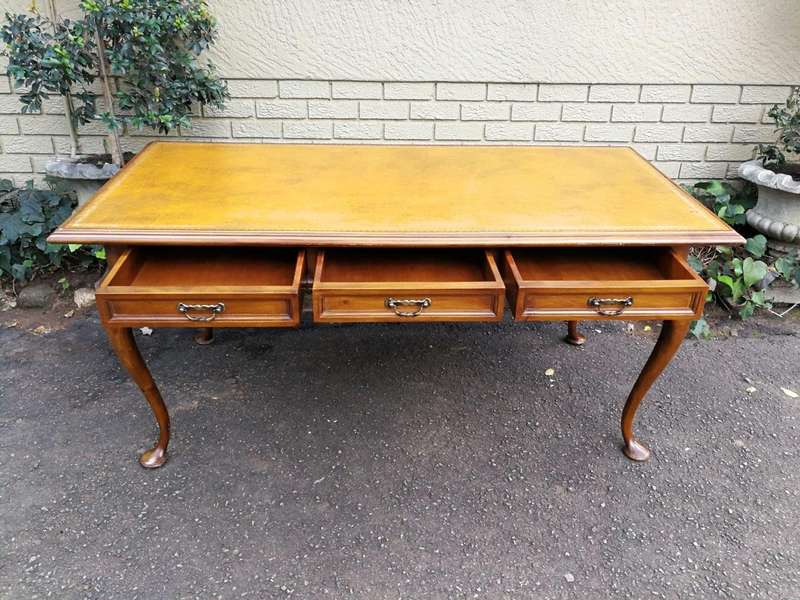 A 20th Century Victorian-Style Blonde Mahogany Desk With Leather And Gilt Tooling And Three Drawe...