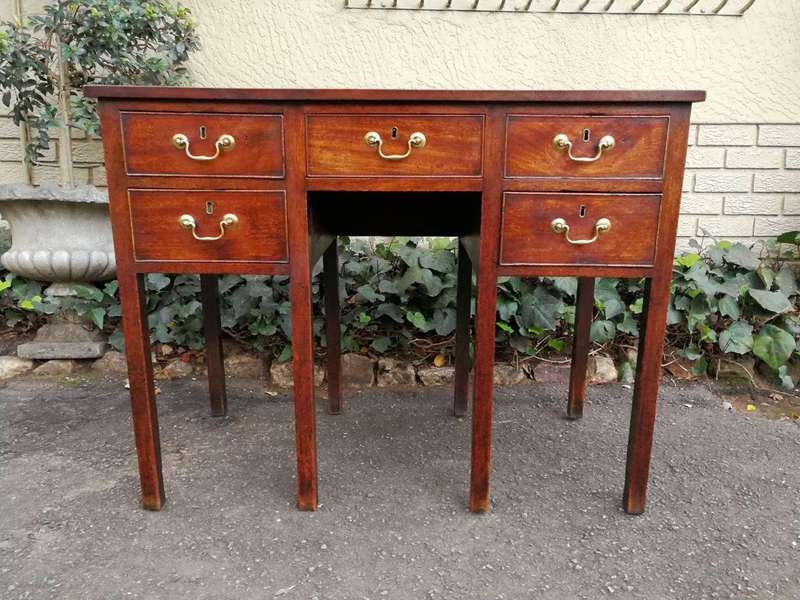 An 18th Century Oak Lowboy, With Brass Escutcheons And Loop Handles