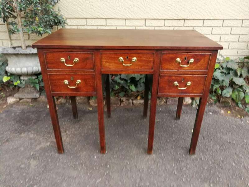 An 18th Century Oak Lowboy, With Brass Escutcheons And Loop Handles