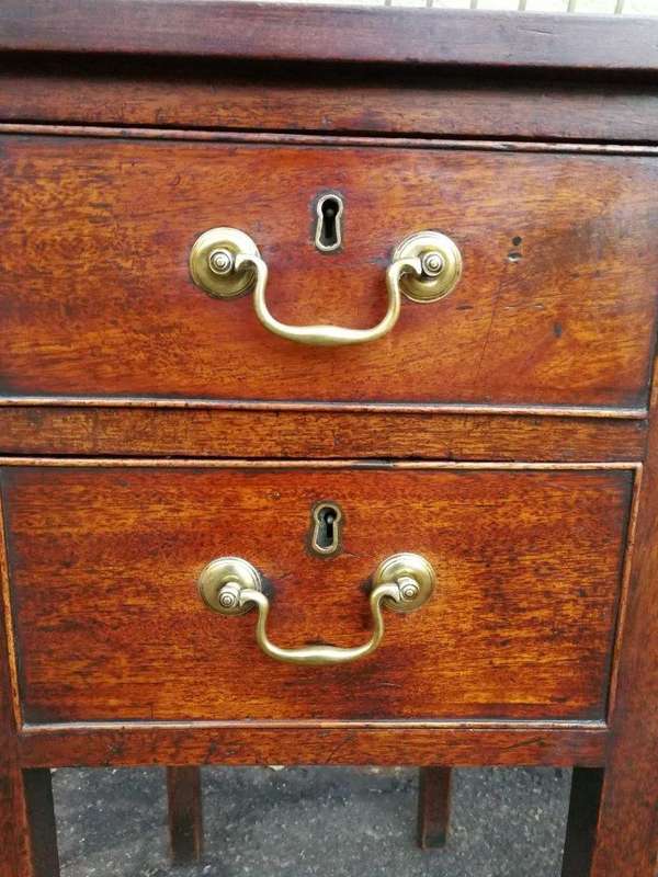 An 18th Century Oak Lowboy, With Brass Escutcheons And Loop Handles