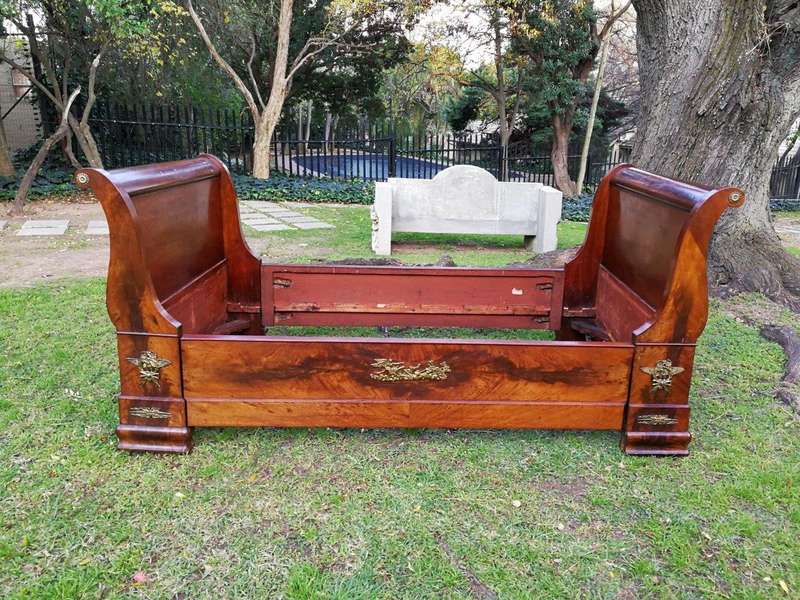 An Early 20th Century French Mahogany Lit Bateau Daybed/Bed With Gilt-Brass And Castors