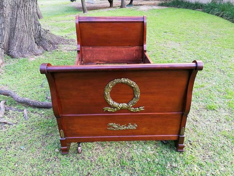 An Early 20th Century French Mahogany Lit Bateau Daybed/Bed With Gilt-Brass And Castors