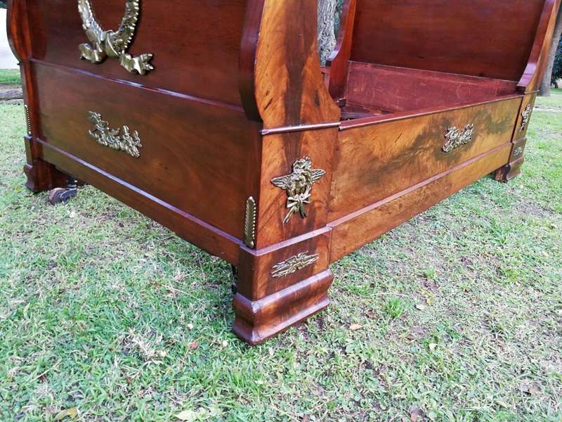 An Early 20th Century French Mahogany Lit Bateau Daybed/Bed With Gilt-Brass And Castors