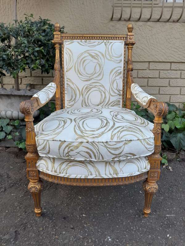 A Pair Of 20th Century Carved Wooden And Gilt-Painted Armchairs