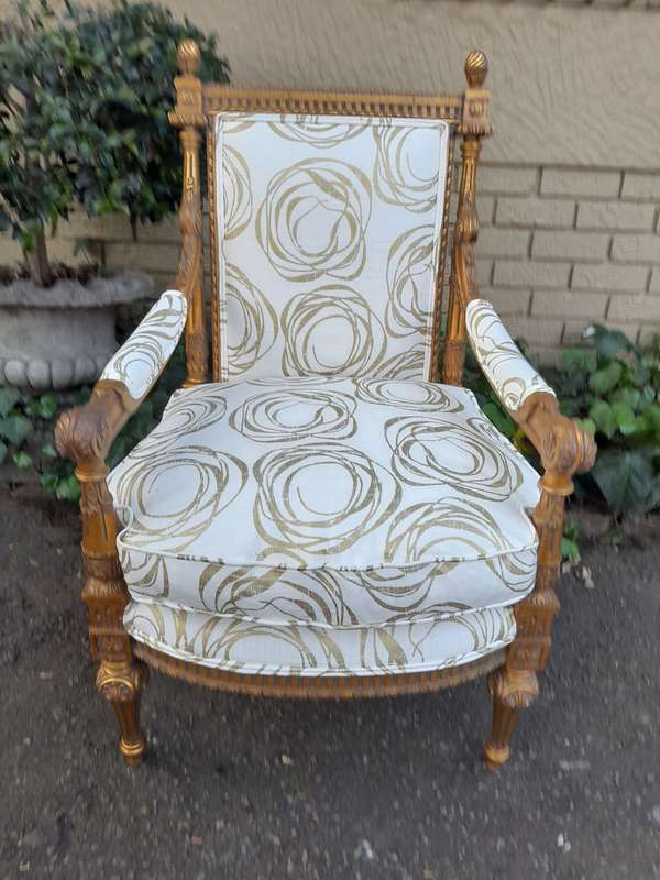 A Pair Of 20th Century Carved Wooden And Gilt-Painted Armchairs