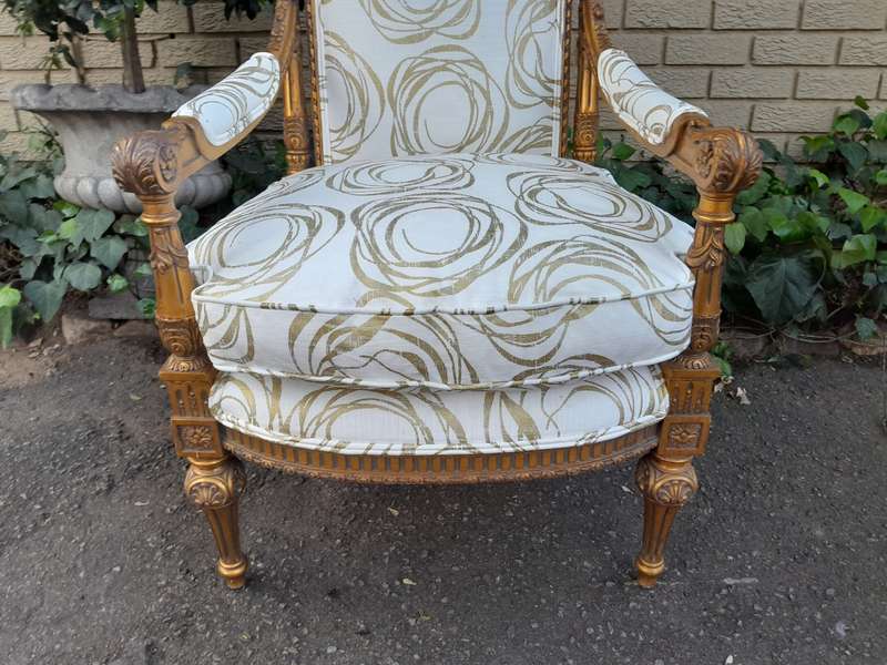 A Pair Of 20th Century Carved Wooden And Gilt-Painted Armchairs
