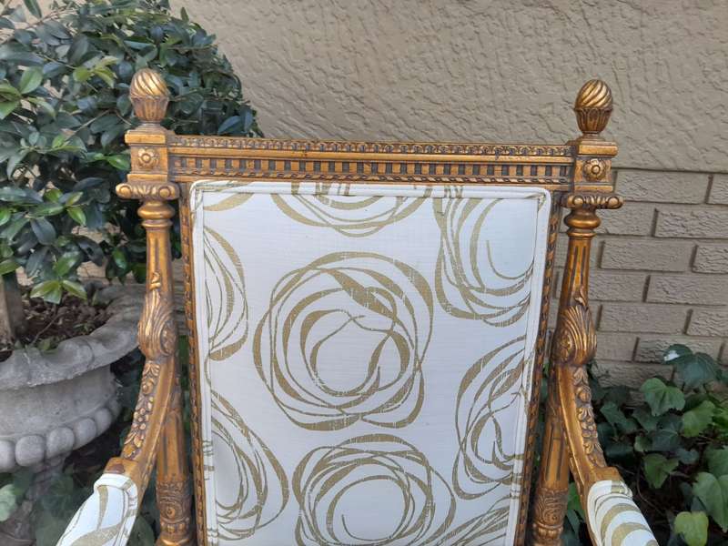 A Pair Of 20th Century Carved Wooden And Gilt-Painted Armchairs