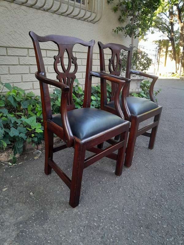 A 19th Century / Circa 1810 Victorian Pair of Carved Oak Armchairs Upholstered in Leather