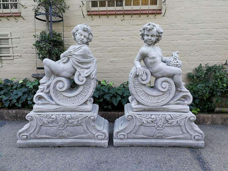 Pair Of Architectural Cherubs On Bases Facing Left And Right