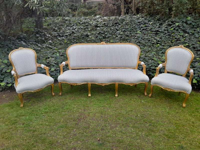 A 20TH Century French-style Carved and Giltwood Settee and a Pair of Armchairs upholsterd in a Co...