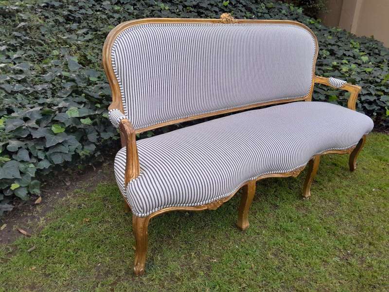 A 20TH Century French-style Carved and Giltwood Settee and a Pair of Armchairs upholsterd in a Co...