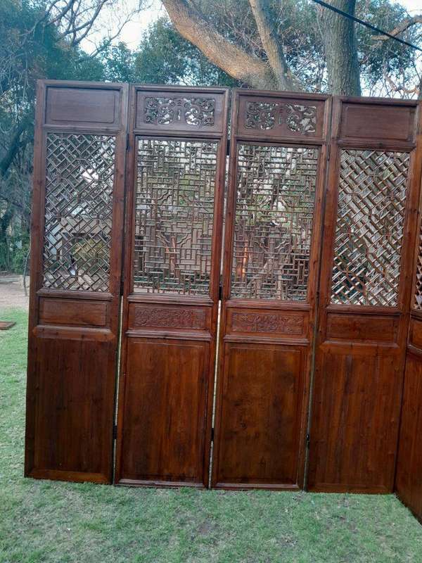 A First Half 20th Century Pair Of Double Chinese Elmwood Screen Panels (Two pairs available)