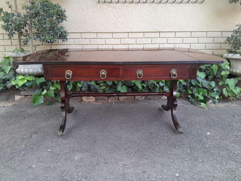 A Victorian Circa 1870, Mahogany Drop-side Library Table, With Drawers and Brass Escurcheons (the...