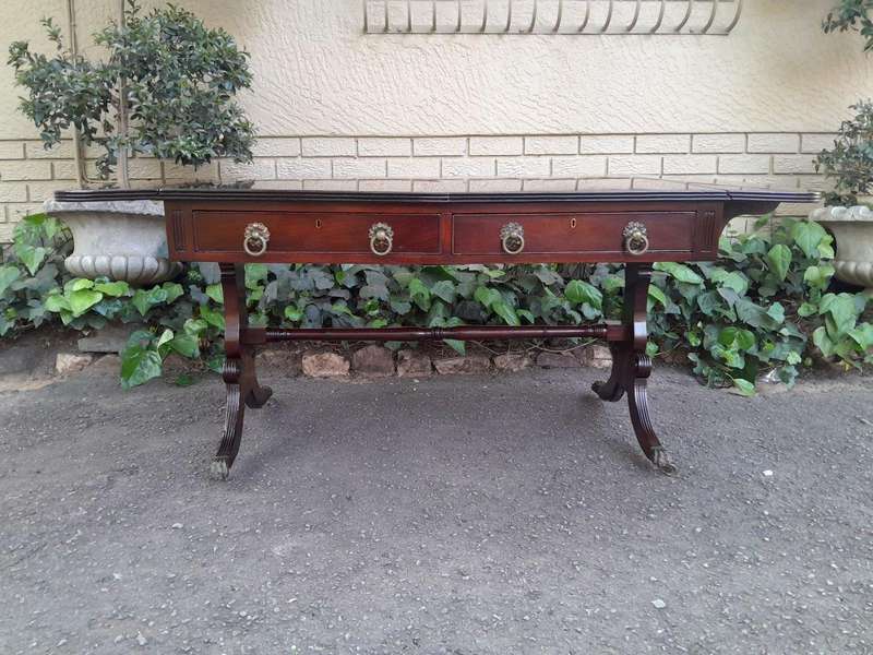 A Victorian Circa 1870, Mahogany Drop-side Library Table, With Drawers and Brass Escurcheons (the...