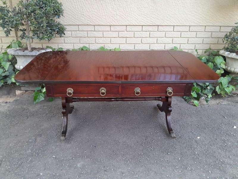 A Victorian Circa 1870, Mahogany Drop-side Library Table, With Drawers and Brass Escurcheons (the...