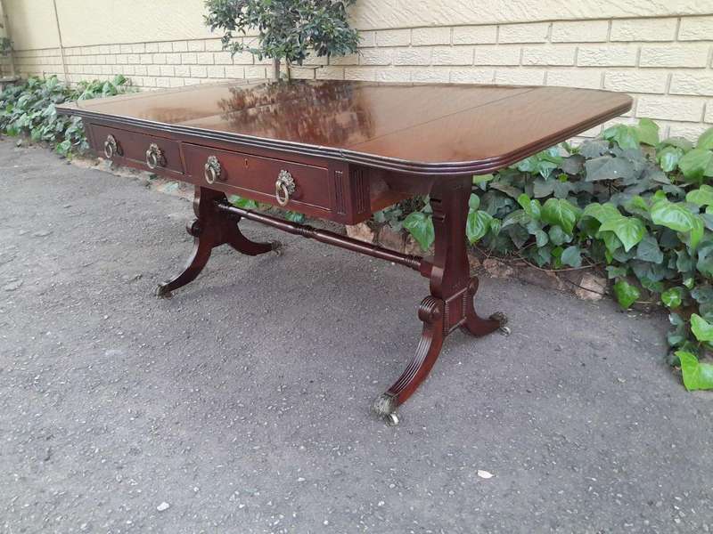 A Victorian Circa 1870, Mahogany Drop-side Library Table, With Drawers and Brass Escurcheons (the...