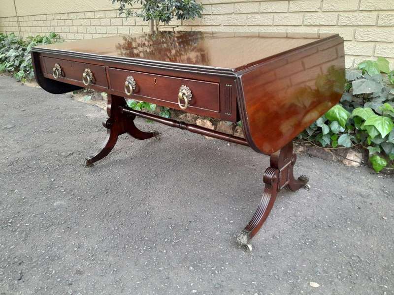 A Victorian Circa 1870, Mahogany Drop-side Library Table, With Drawers and Brass Escurcheons (the...