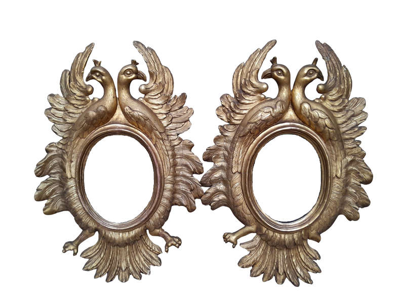 A 20th Century Pair Of Carved Mirrors With Stylised Bird Design