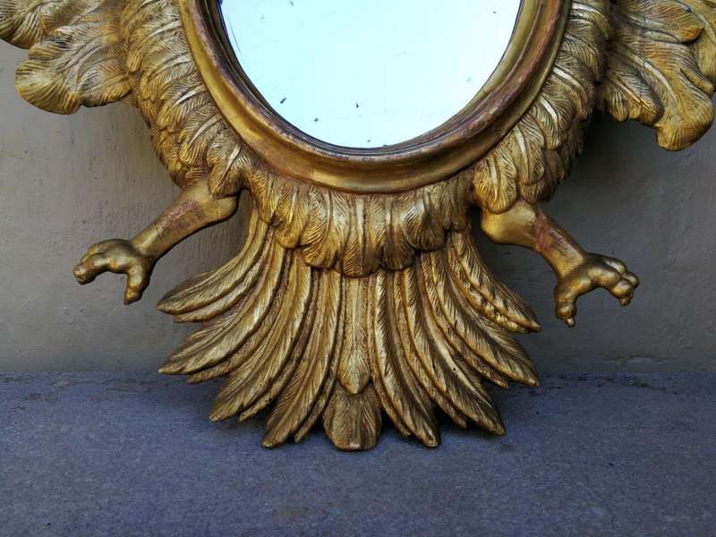 A 20th Century Pair Of Carved Mirrors With Stylised Bird Design