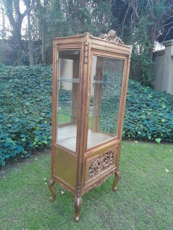 A French Louis XVI Showcase From The 1800s Gilded With Gold Leaf