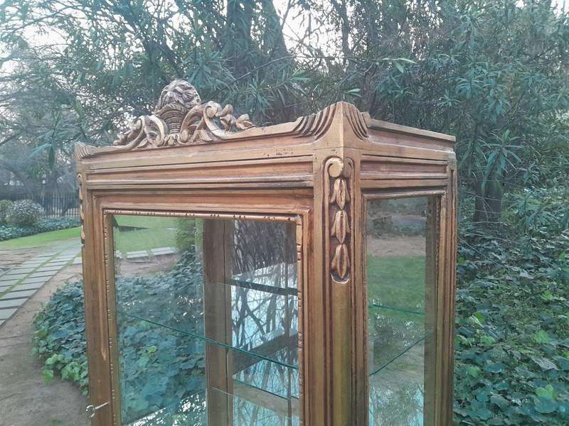 A French Louis XVI Showcase From The 1800s Gilded With Gold Leaf