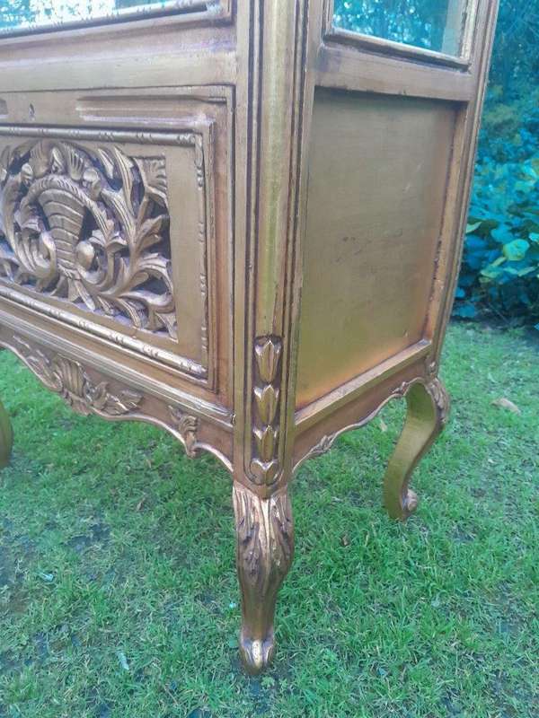 A French Louis XVI Showcase From The 1800s Gilded With Gold Leaf