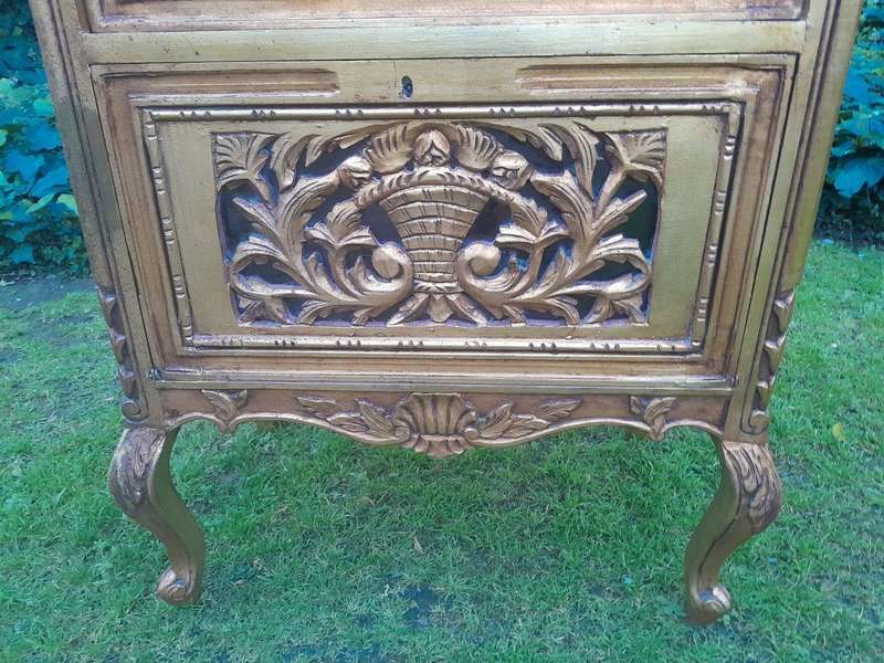 A French Louis XVI Showcase From The 1800s Gilded With Gold Leaf