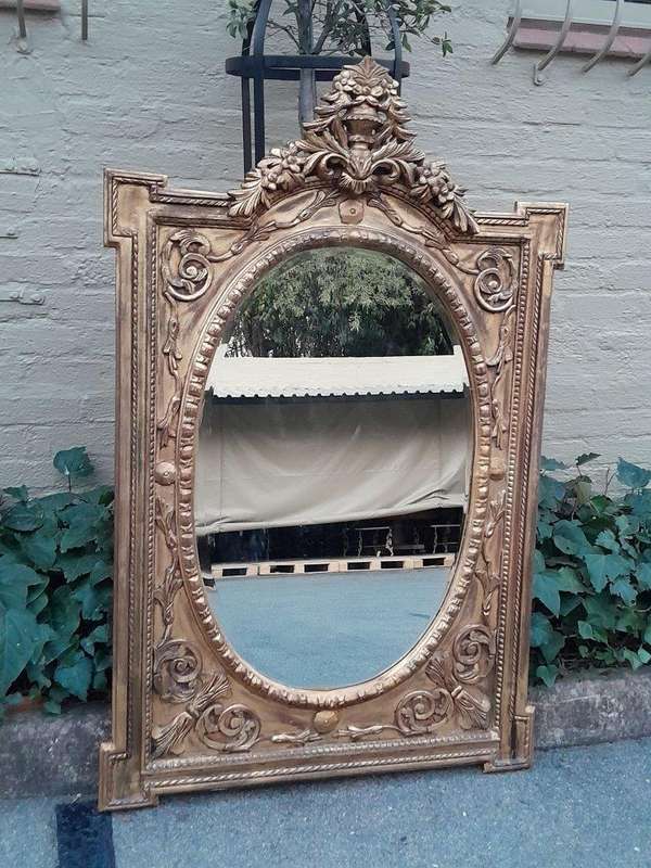 A 20th Century Ornately Carved and Bevelled Gilt-wood  Mirror