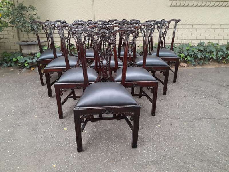 A 20th Century Set of Ten English Mahogany Chippendale Style Chairs with Leather Upholstered Seats