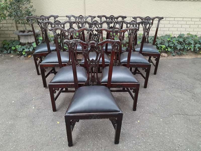 A 20th Century Set of Ten English Mahogany Chippendale Style Chairs with Leather Upholstered Seats
