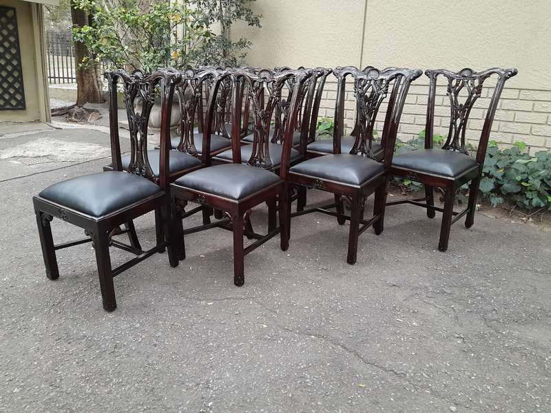 A 20th Century Set of Ten English Mahogany Chippendale Style Chairs with Leather Upholstered Seats