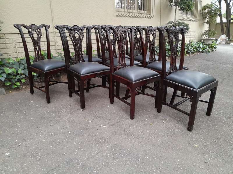 A 20th Century Set of Ten English Mahogany Chippendale Style Chairs with Leather Upholstered Seats