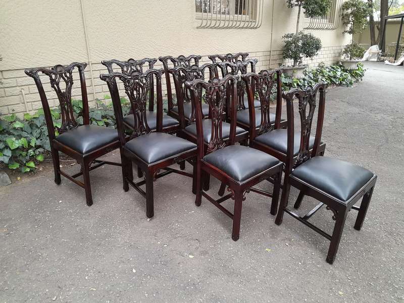 A 20th Century Set of Ten English Mahogany Chippendale Style Chairs with Leather Upholstered Seats