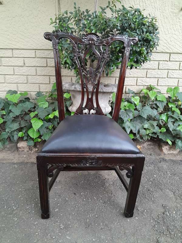 A 20th Century Set of Ten English Mahogany Chippendale Style Chairs with Leather Upholstered Seats