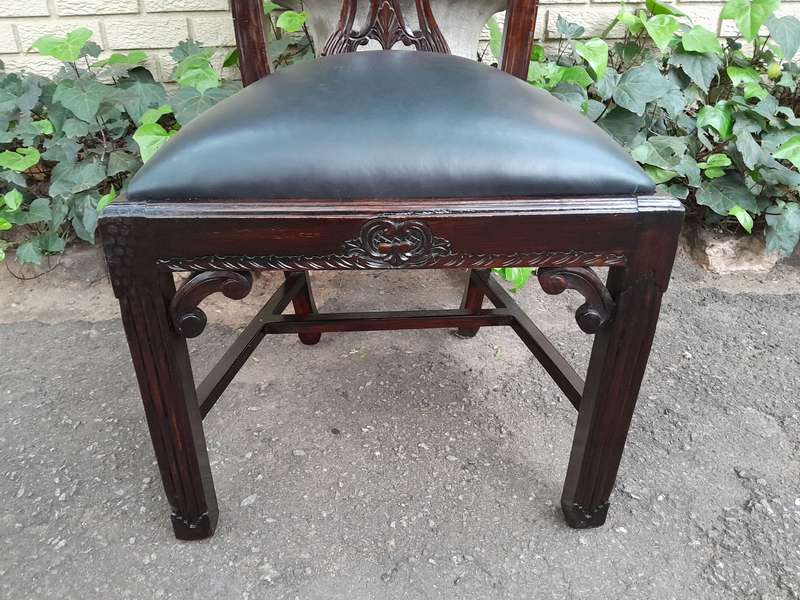 A 20th Century Set of Ten English Mahogany Chippendale Style Chairs with Leather Upholstered Seats