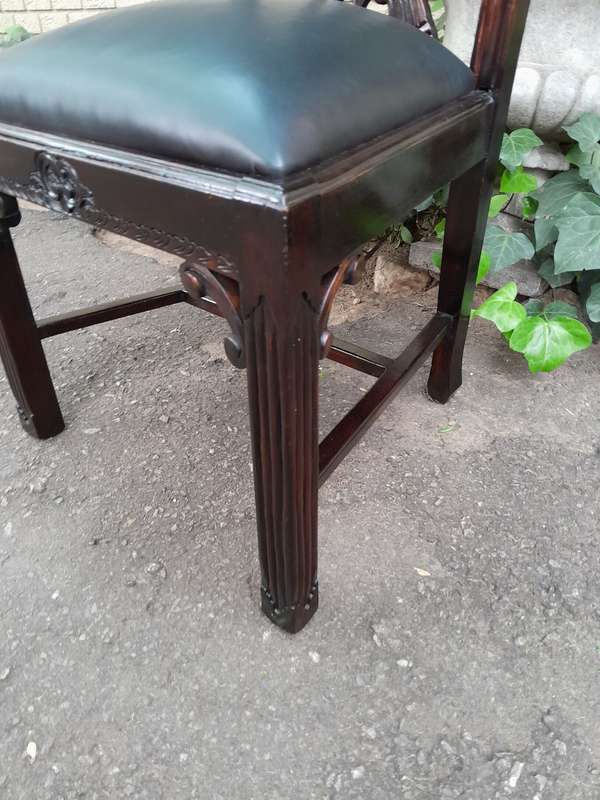 A 20th Century Set of Ten English Mahogany Chippendale Style Chairs with Leather Upholstered Seats